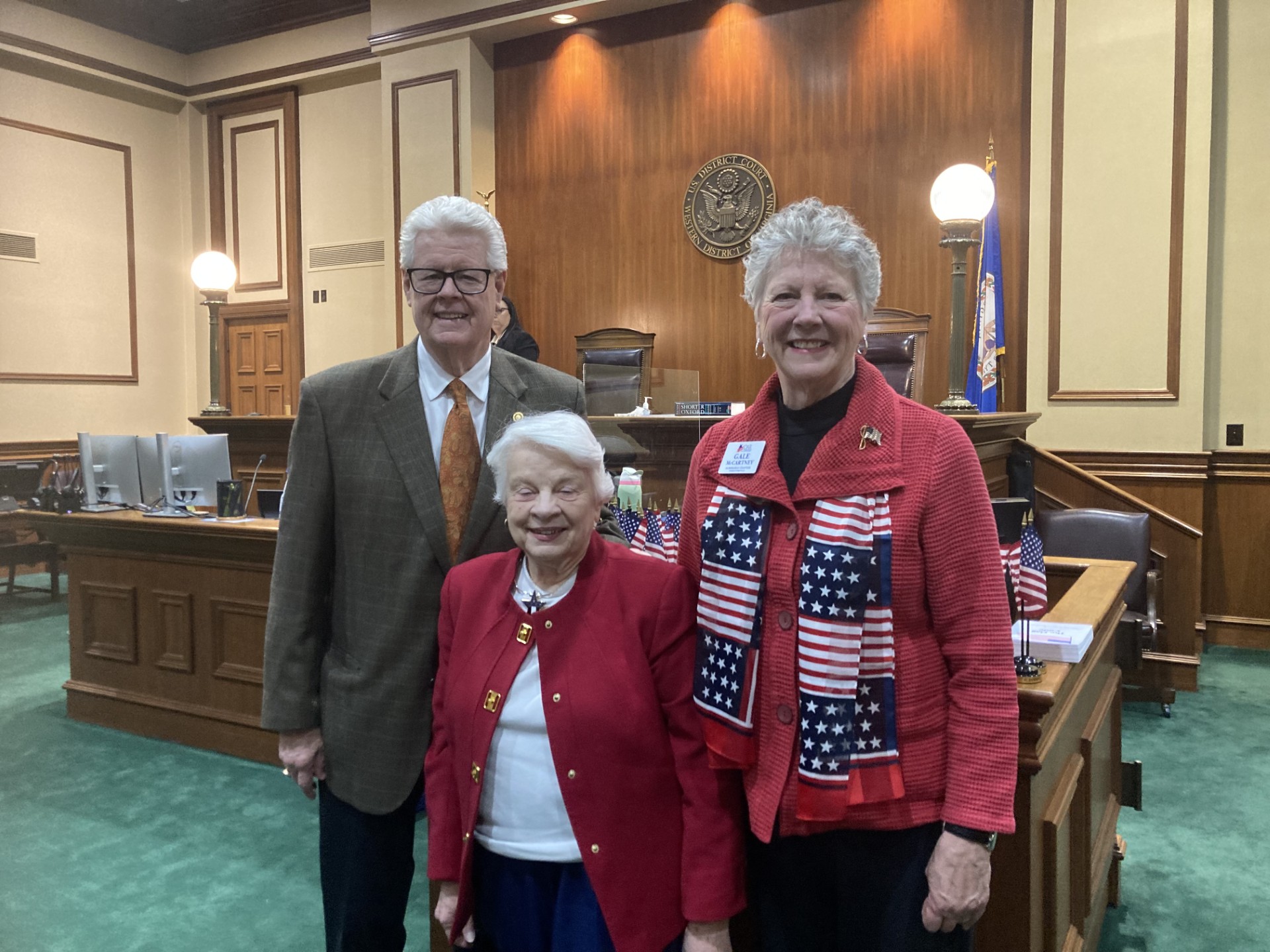 SAR compatriot John Sloop pose for a photo with NSDAR members Charlotte Bailey (Albemarle Chapter, NSDAR) and Gale McCarty (Massanutton Chapter, NSDAR), after the naturalization ceremony held at the U.S. District courthouse in Harrisonburg, Virginia