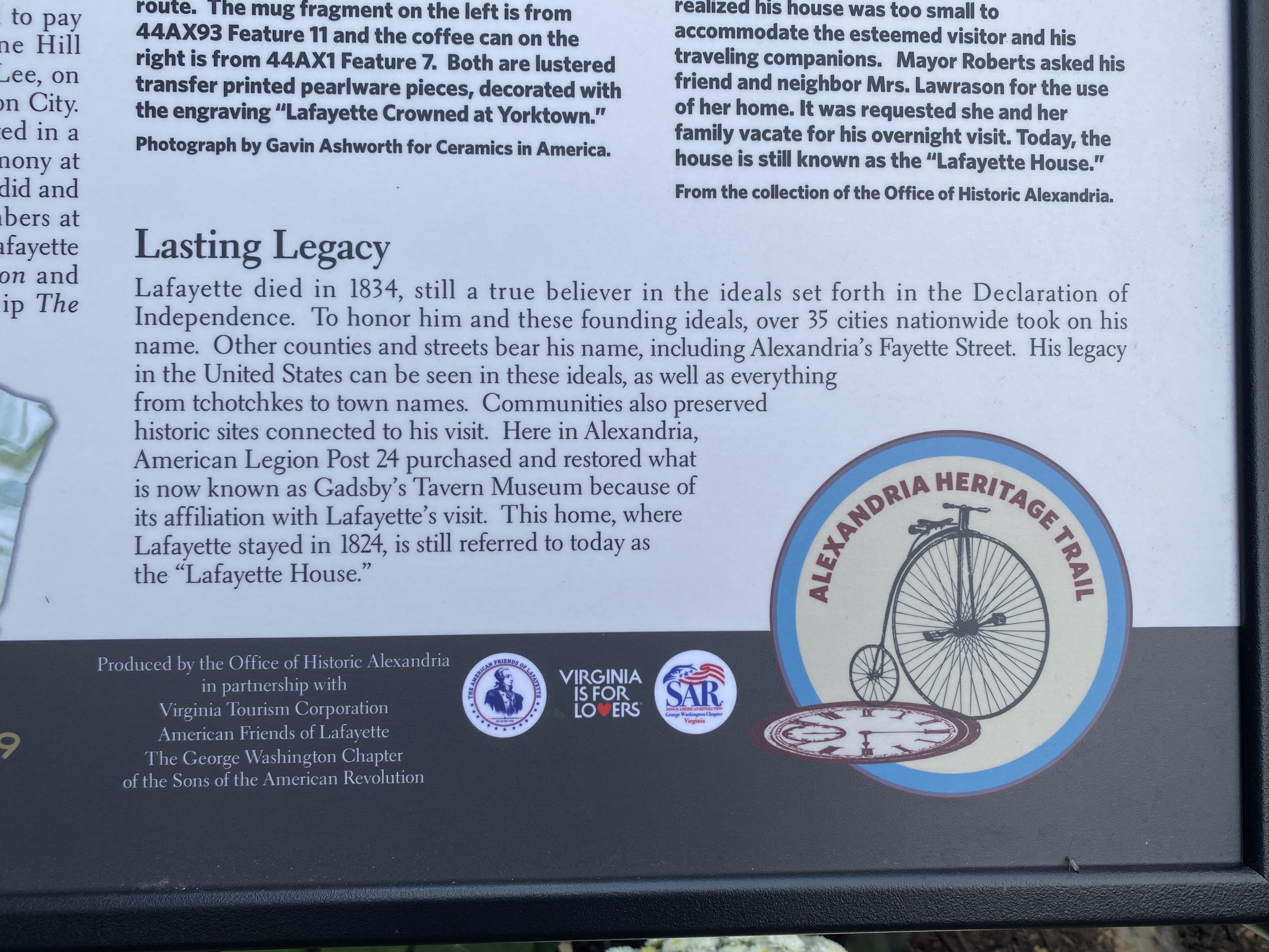 Section of trail marker with George Washington Chapter Virginia SAR logo in focus.